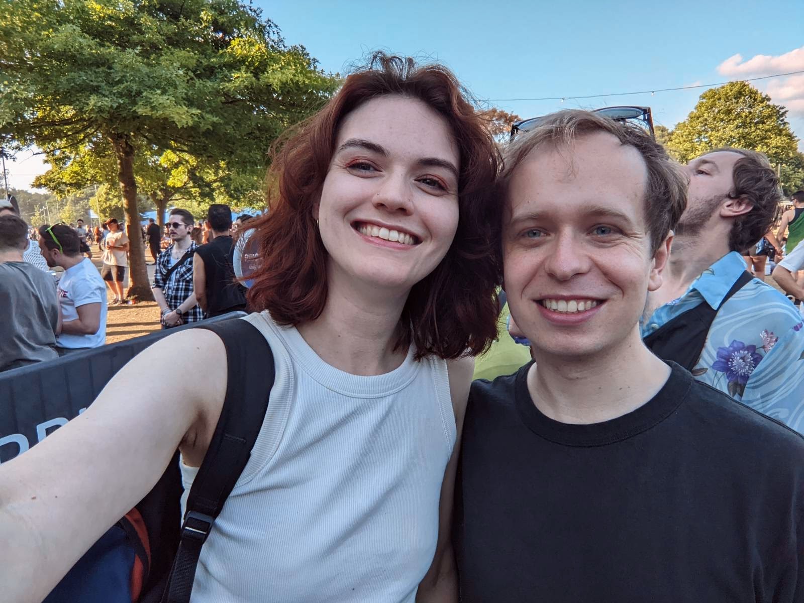A picture of Casper & Rose at a field festival. They both are smiling